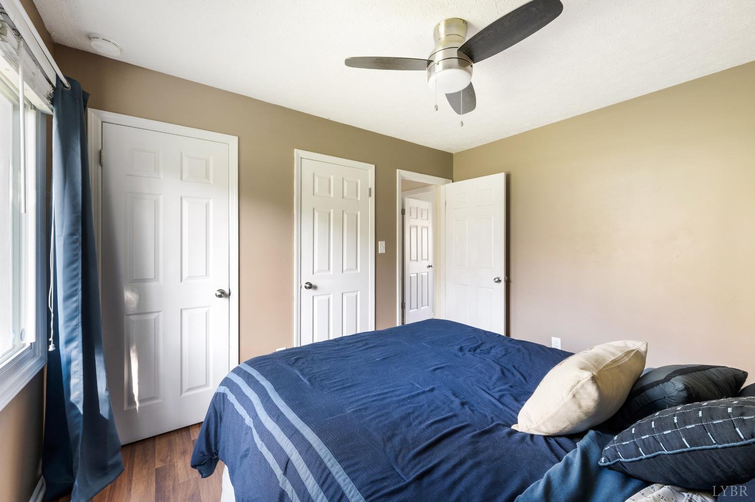 503 Sweeney Circle Forest, VA 24551 - Photo 17 of 50 a bedroom with a bed and a chandelier