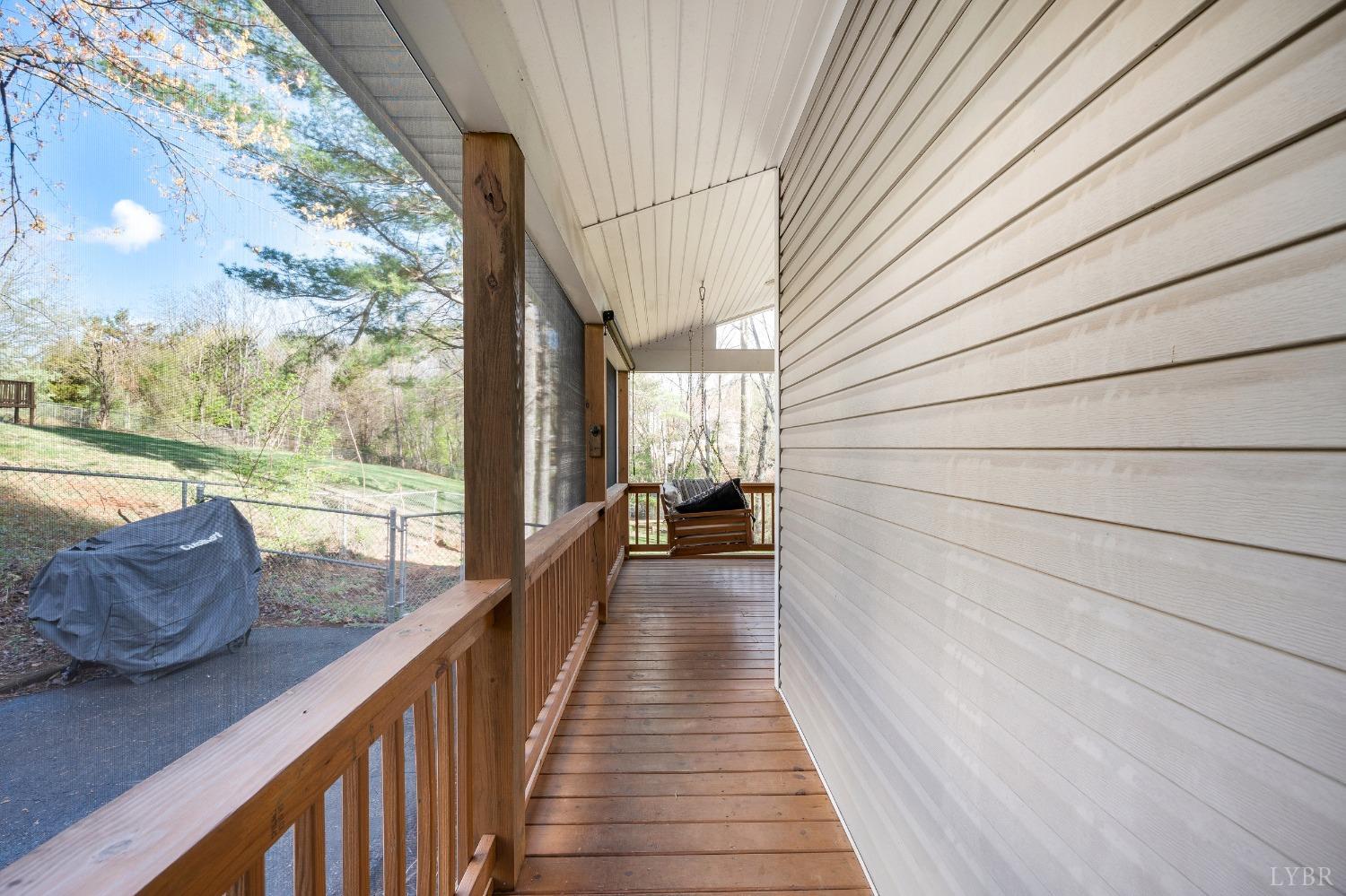503 Sweeney Circle Forest, VA 24551 - Photo 22 of 50 a view of a balcony with couches and wooden floor