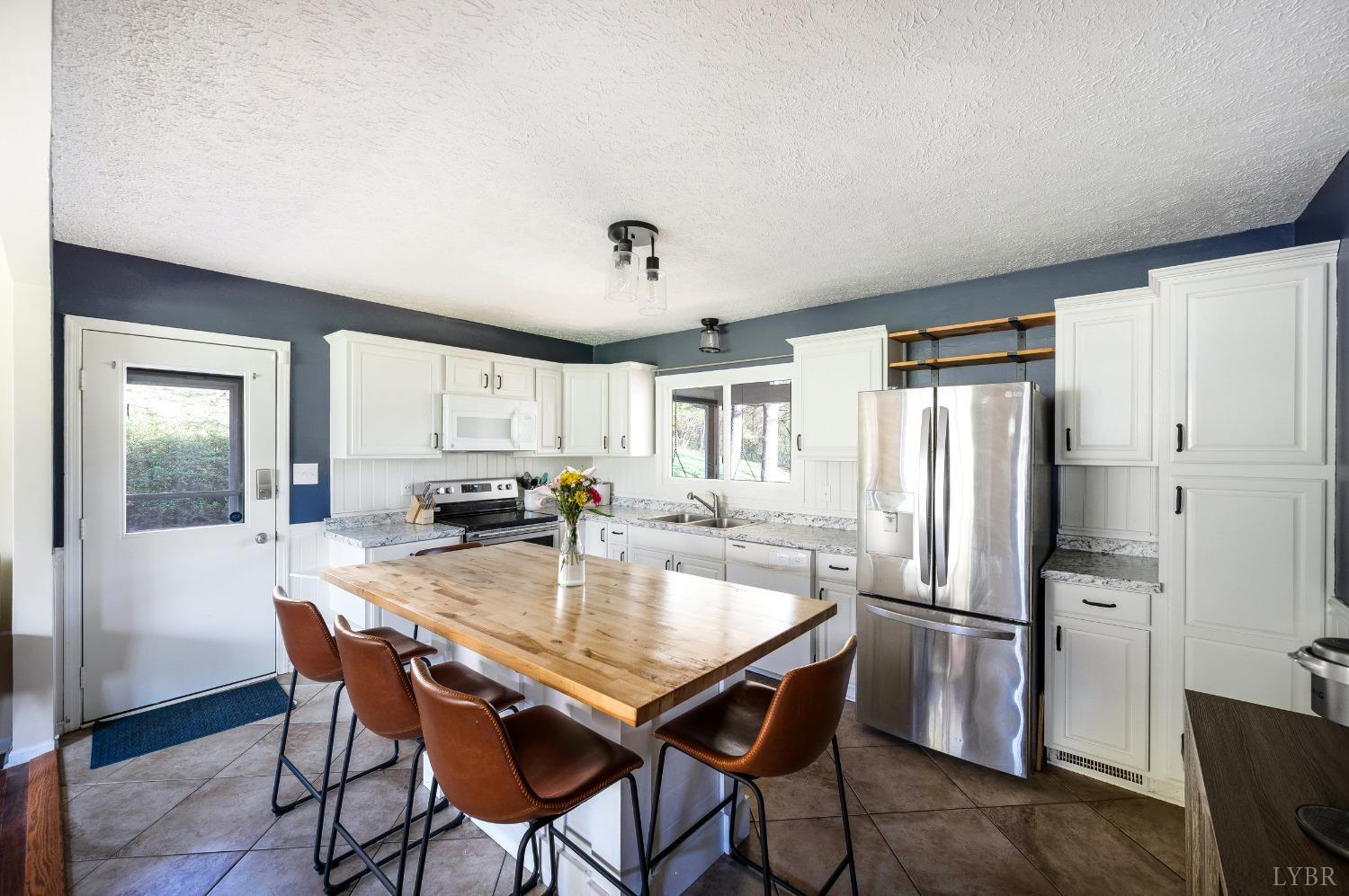 503 Sweeney Circle Forest, VA 24551 - Photo 7 of 50 a kitchen with stainless steel appliances granite countertop a dining table and chairs
