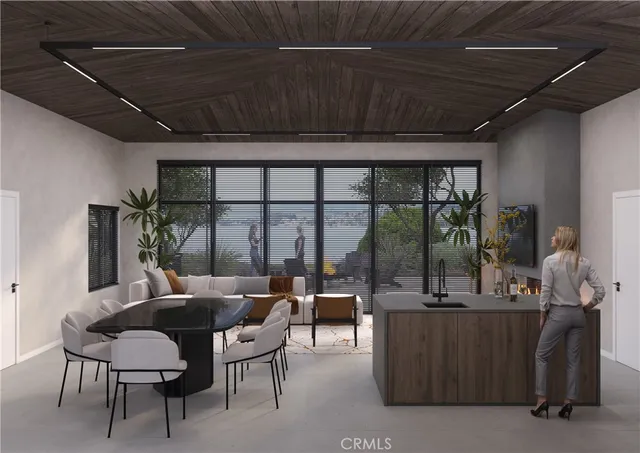 a dining room with furniture and a floor to ceiling window