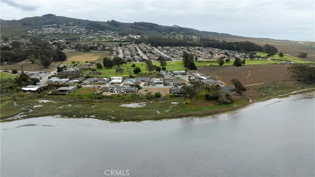 a view of a town with mountains in the background