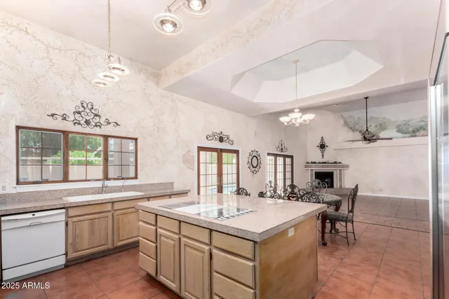 a kitchen with a sink a counter space and appliances