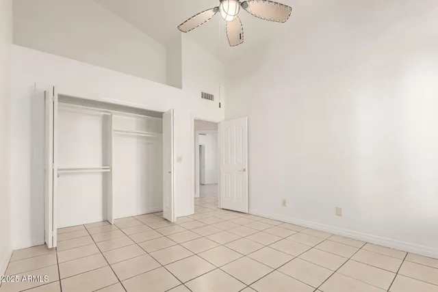 a bathroom with a granite countertop sink a toilet and a mirror