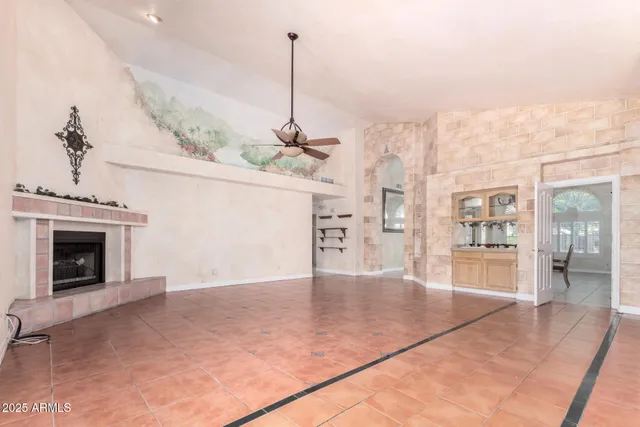 a view of an empty room with a fireplace