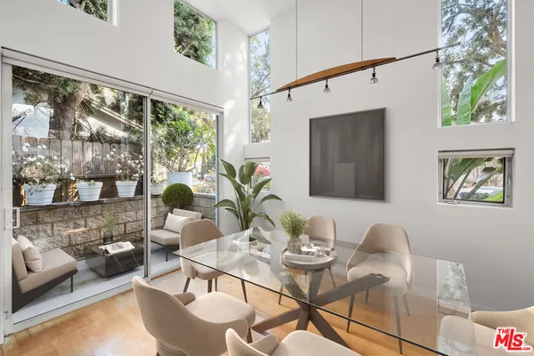 a view of a dining room with furniture window and outside view