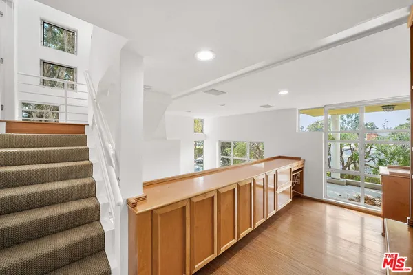 a view of a hallway with windows