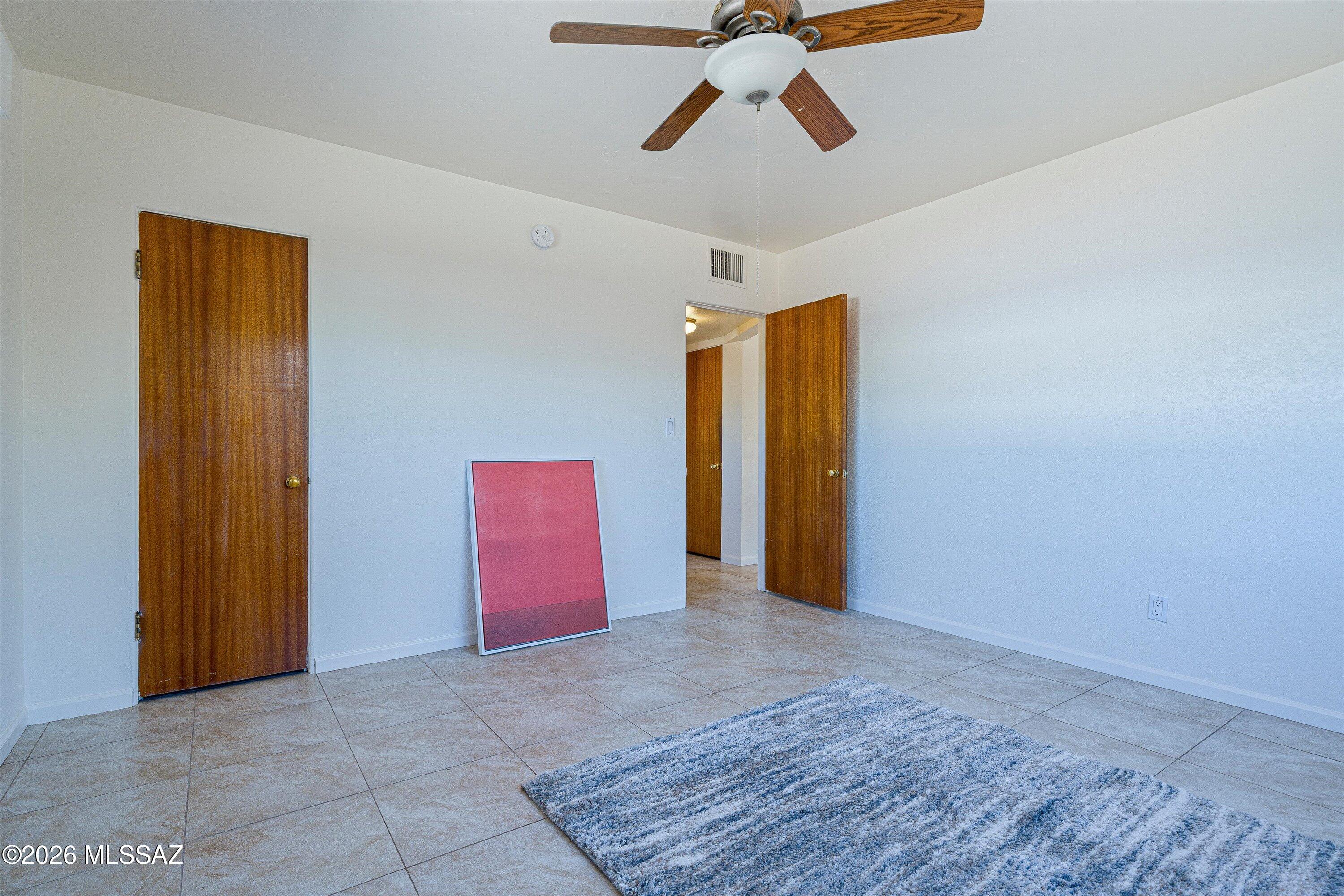 2451 North Richey Boulevard Tucson, AZ 85716 - Photo 13 of 24 …and straight shot to bathroom. Where you’ll find...