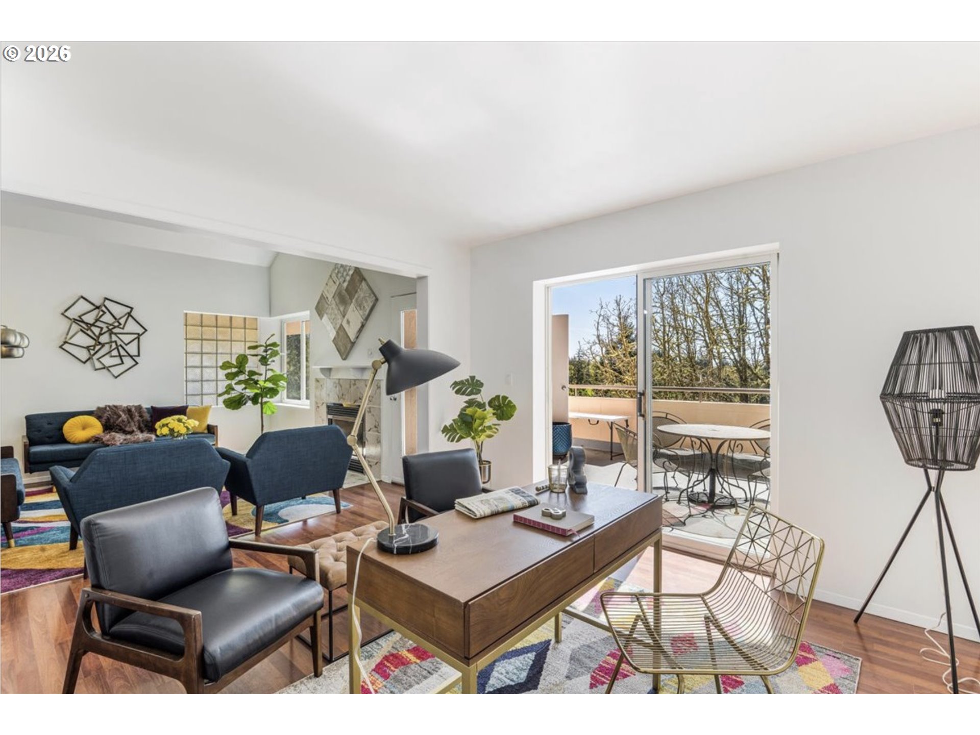 6645 West Burnside Street, Unit 550 Portland, OR 97225 - Photo 11 of 38 a living room with furniture a flat screen tv and a large window