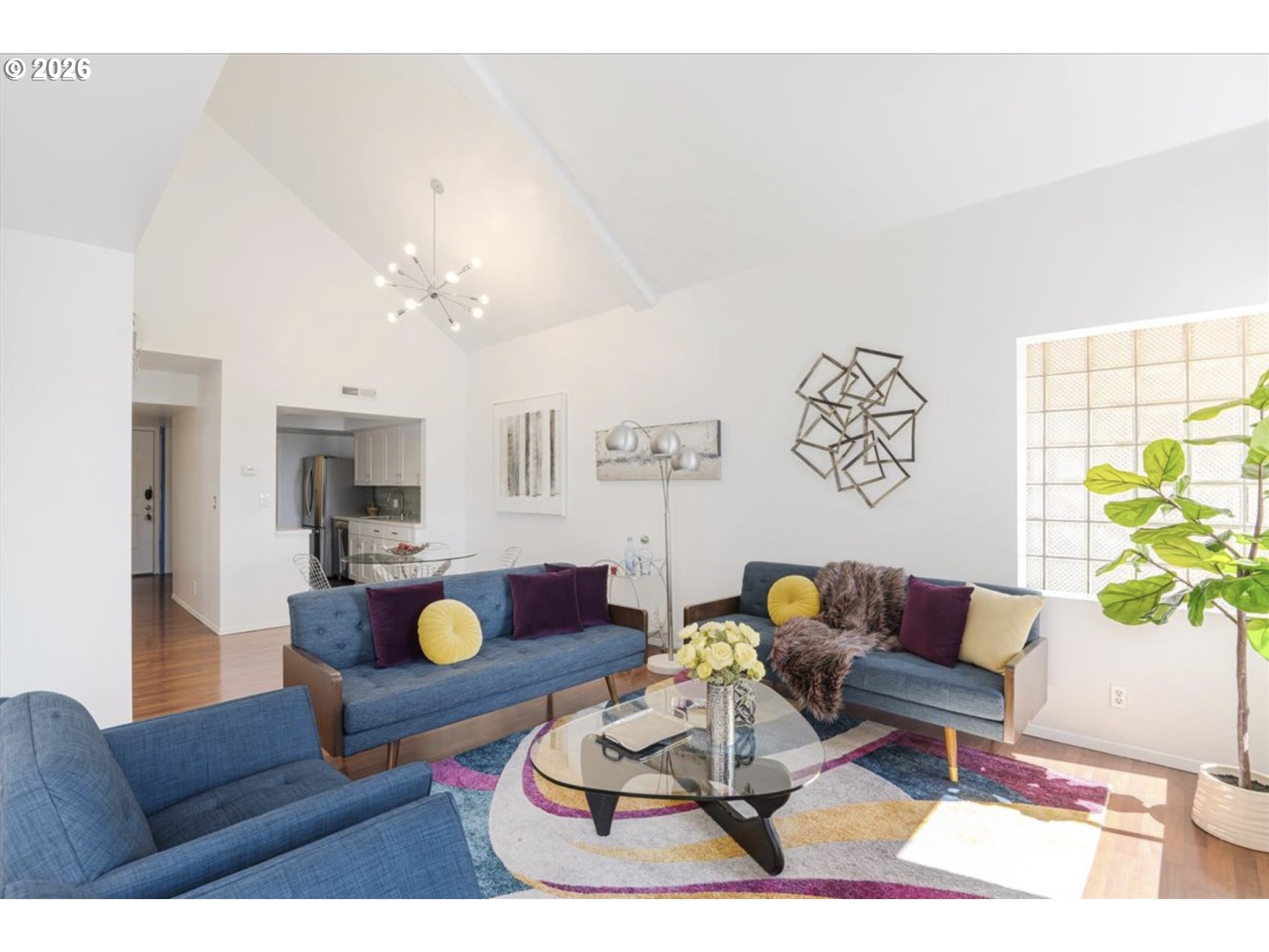 6645 West Burnside Street, Unit 550 Portland, OR 97225 - Photo 13 of 38 a living room with furniture and wooden floor