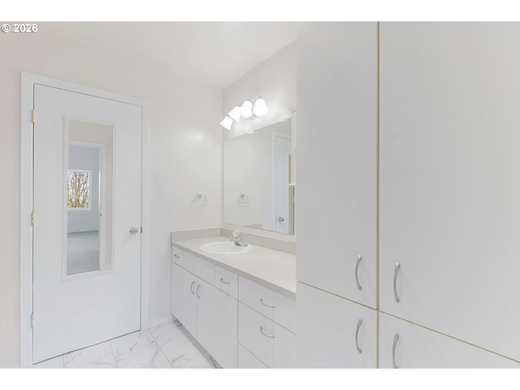 6645 West Burnside Street, Unit 550 Portland, OR 97225 - Photo 20 of 38 a bathroom with a sink and a mirror