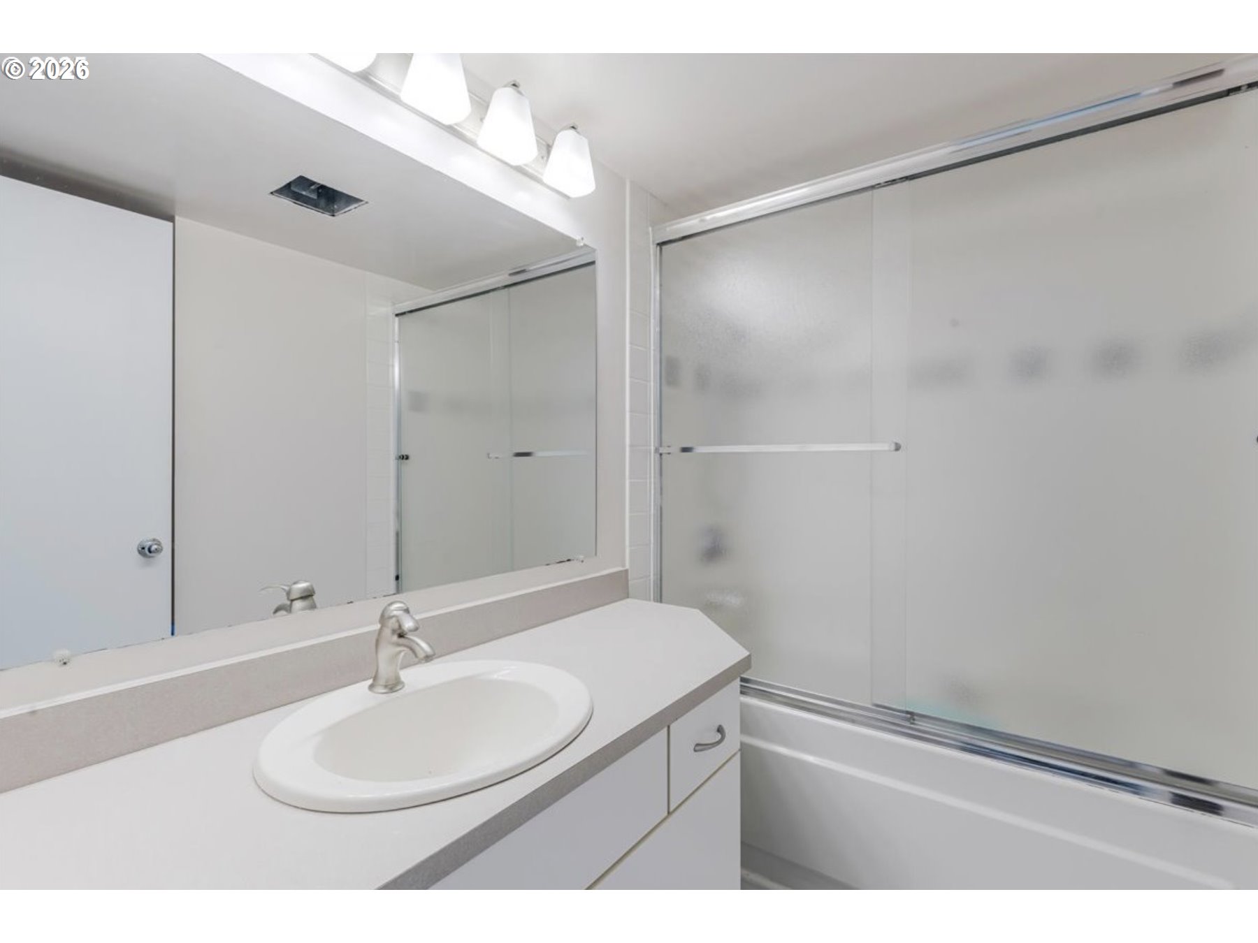 6645 West Burnside Street, Unit 550 Portland, OR 97225 - Photo 23 of 38 a bathroom with a sink and a mirror