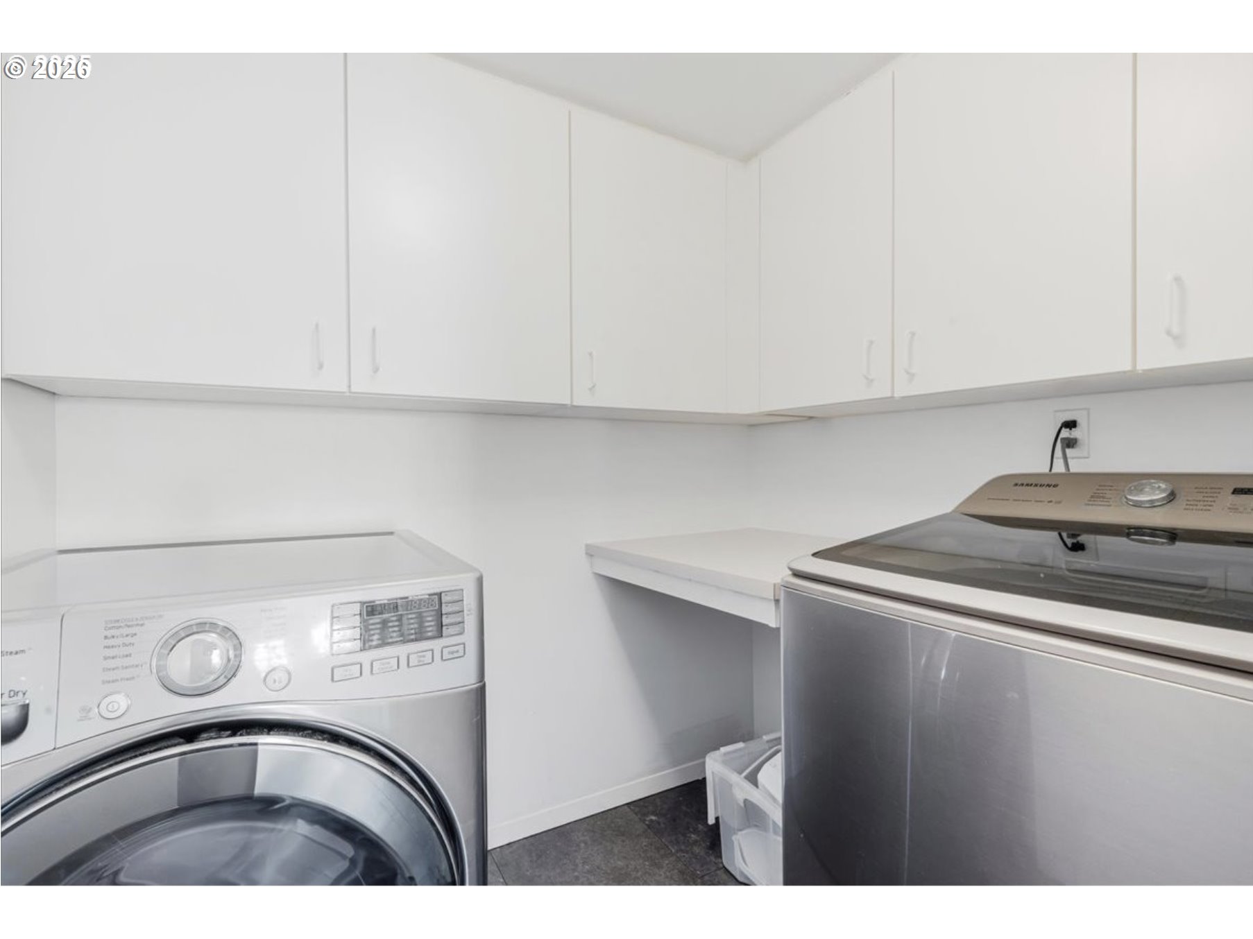 6645 West Burnside Street, Unit 550 Portland, OR 97225 - Photo 24 of 38 a utility room with dryer and washer
