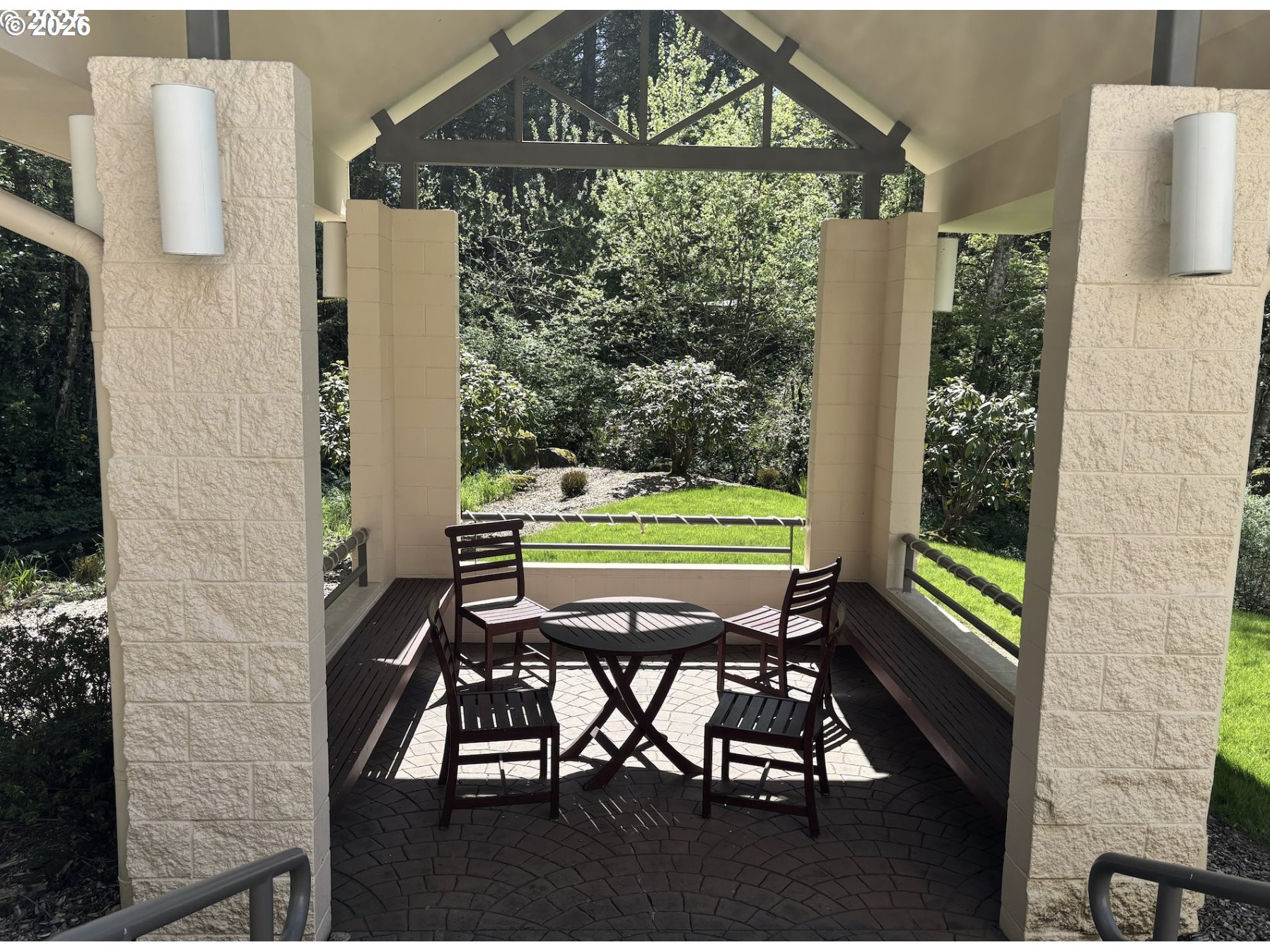 6645 West Burnside Street, Unit 550 Portland, OR 97225 - Photo 30 of 38 a view of a chairs and table in a patio