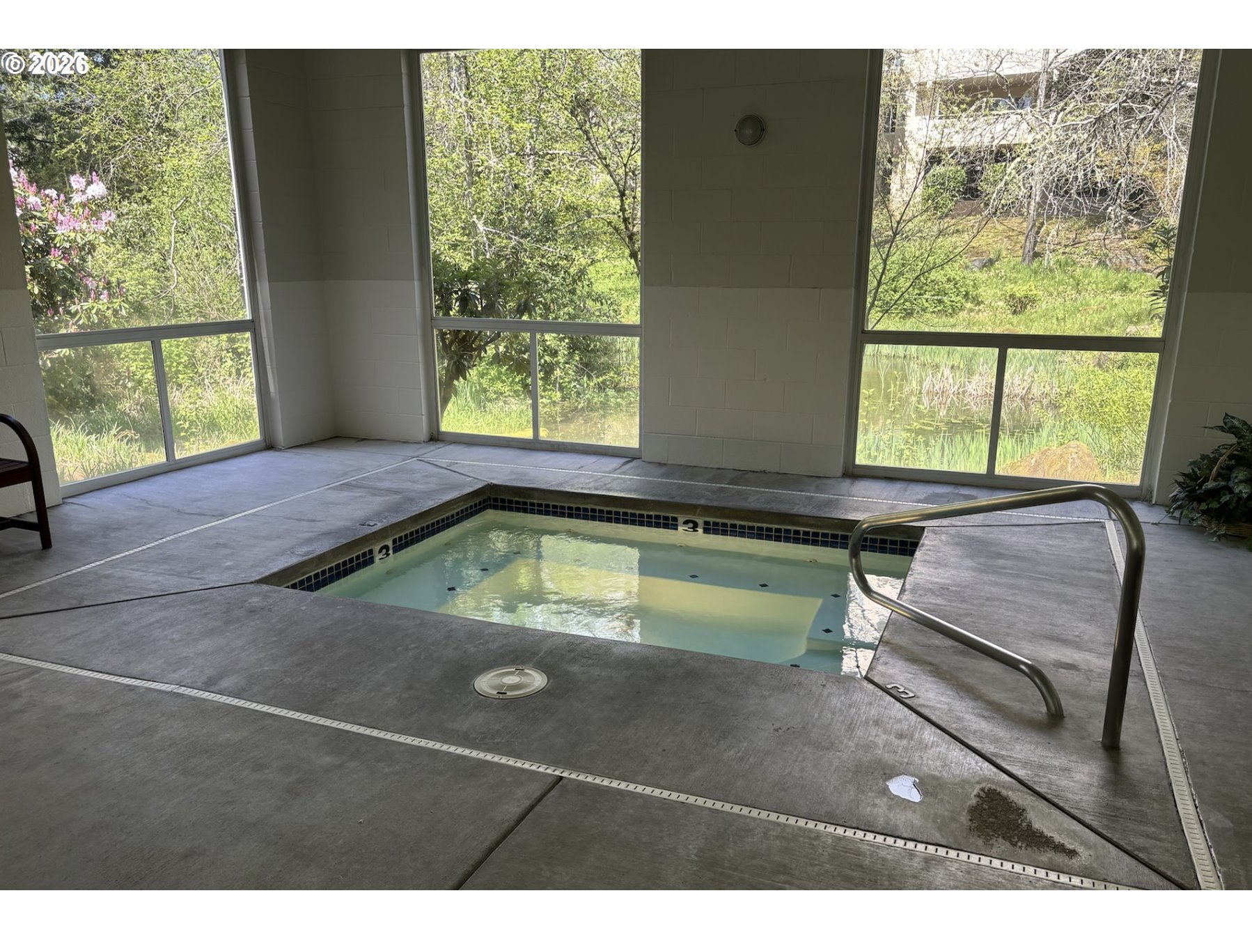 6645 West Burnside Street, Unit 550 Portland, OR 97225 - Photo 36 of 38 a swimming pool with outdoor seating and yard