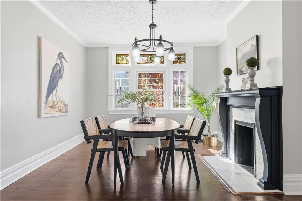210 Elm Street Pittsburgh, PA 15218 - Photo 12 of 36 a view of a dining room with furniture and wooden floor