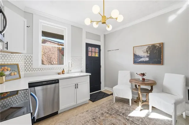 a kitchen with a sink stove and microwave