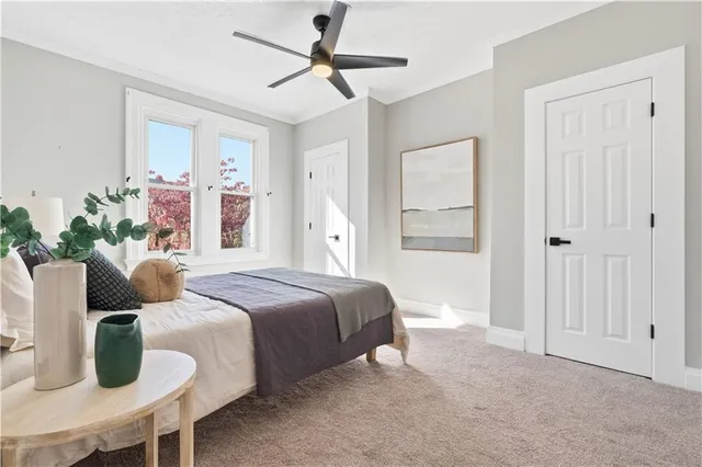 a bedroom with a bed and window