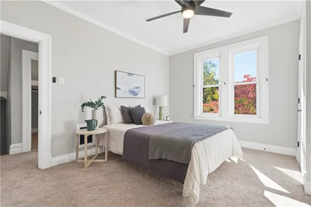 a view of a livingroom with furniture and a window