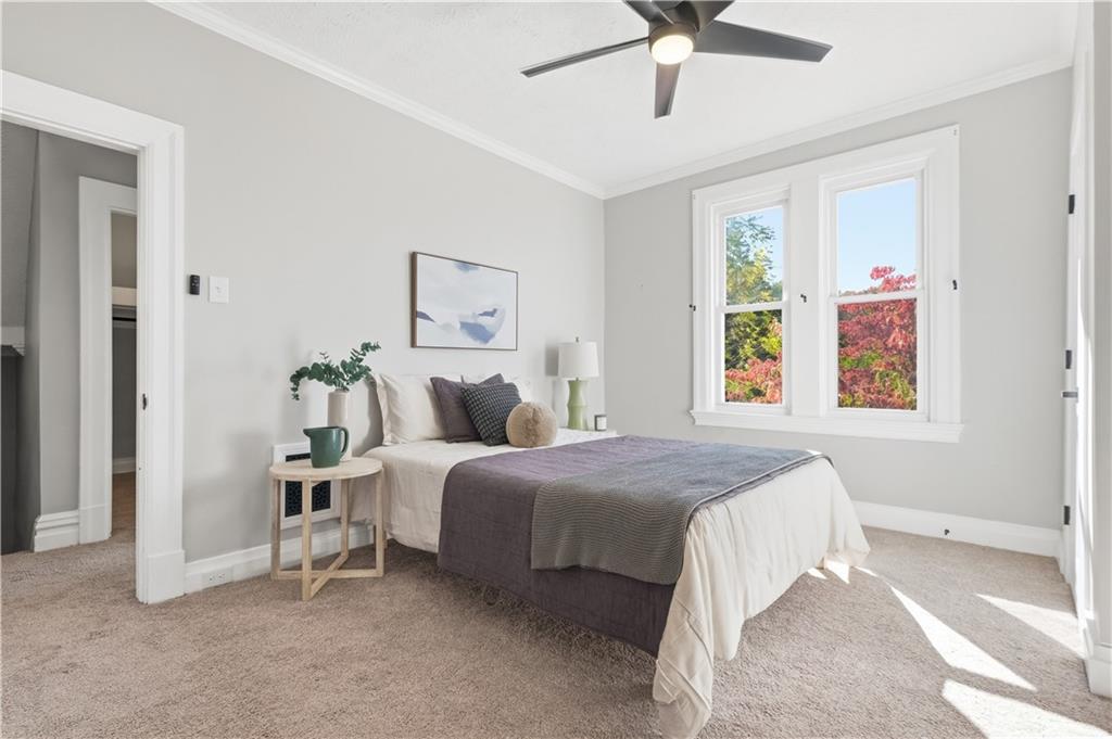 210 Elm Street Pittsburgh, PA 15218 - Photo 21 of 36 a bedroom with a bed and window