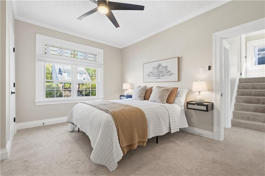 210 Elm Street Pittsburgh, PA 15218 - Photo 23 of 36 a spacious bedroom with a bed and window