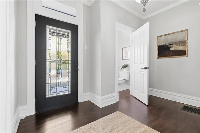 a view of entryway and hall with wooden floor