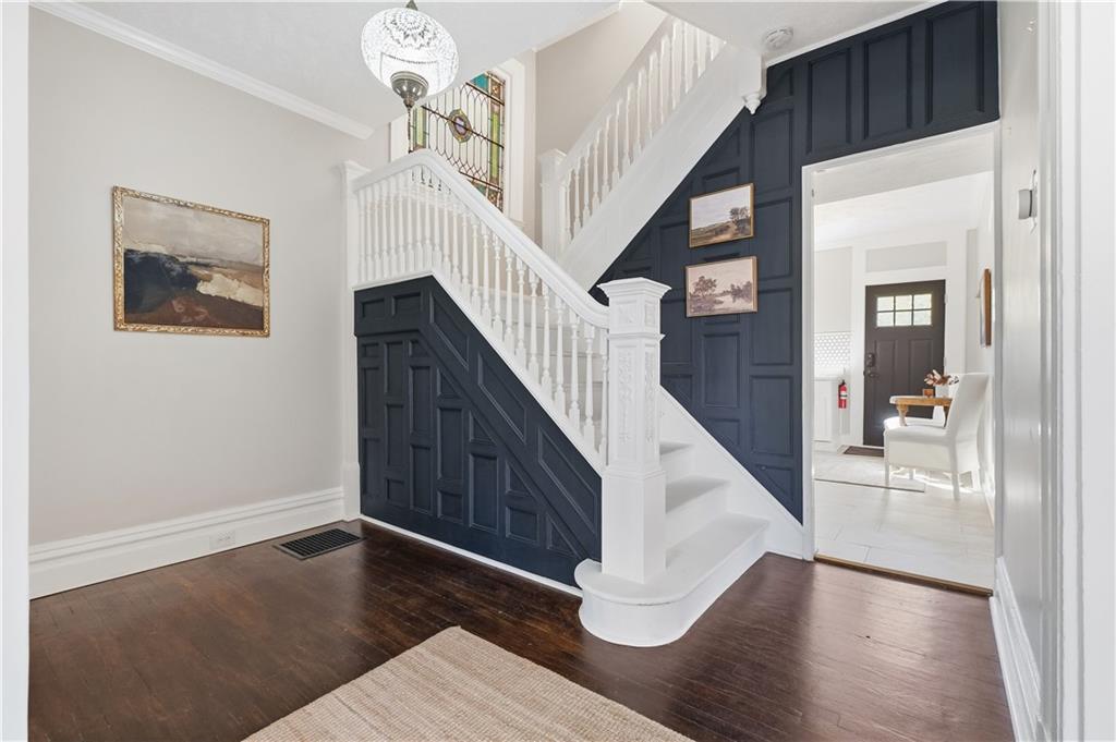 210 Elm Street Pittsburgh, PA 15218 - Photo 6 of 36 a view of entryway and hall with wooden floor