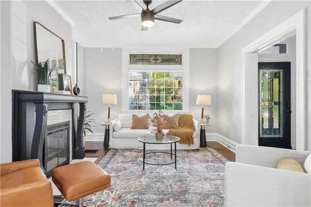 a living room with furniture and a fireplace