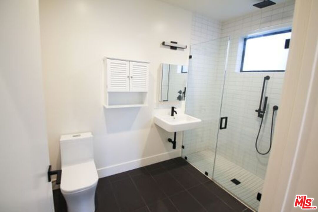 321 North Bixel Street, Unit 2 Los Angeles, CA 90026 - Photo 12 of 22 a bathroom with a sink toilet and shower