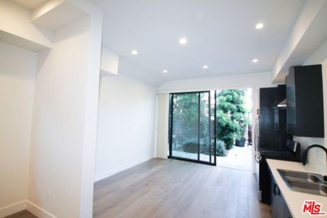 321 North Bixel Street, Unit 2 Los Angeles, CA 90026 - Photo 15 of 22 a view of a livingroom with furniture wooden floor and a tub