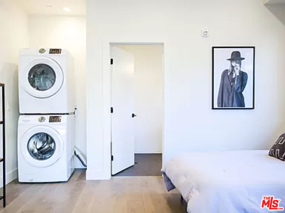 321 North Bixel Street, Unit 2 Los Angeles, CA 90026 - Photo 5 of 22 a bedroom with a washer and dryer