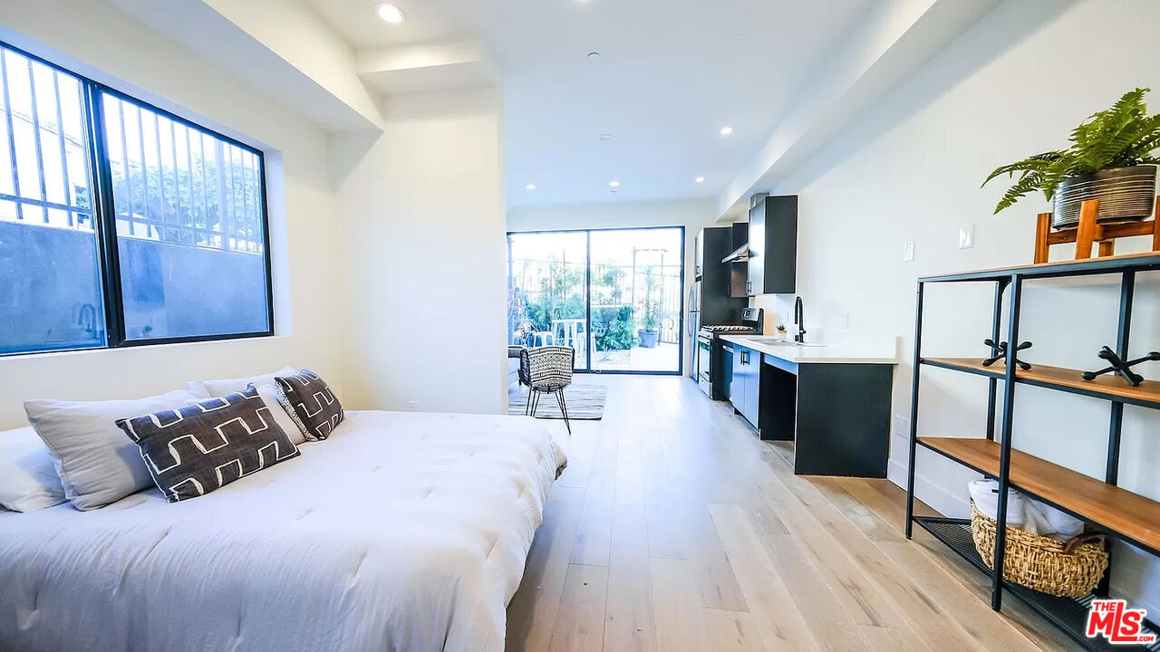 321 North Bixel Street, Unit 2 Los Angeles, CA 90026 - Photo 6 of 22 a large bedroom with a bed and a large window