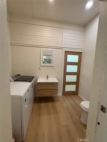 a spacious bathroom with a sink a toilet and shower