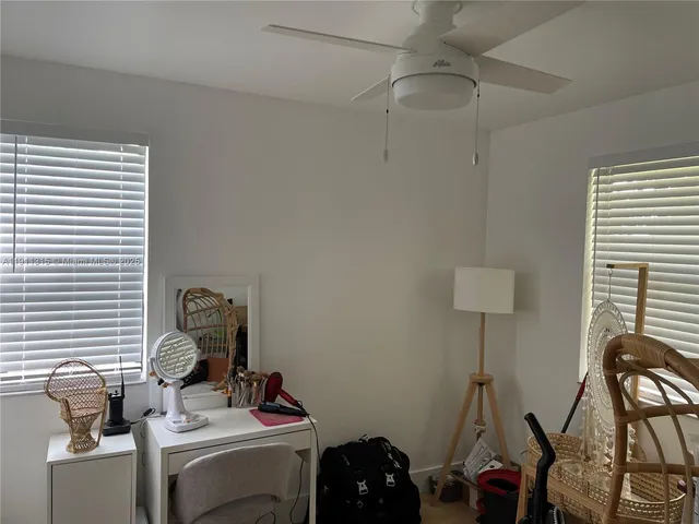 a work room with furniture and windows