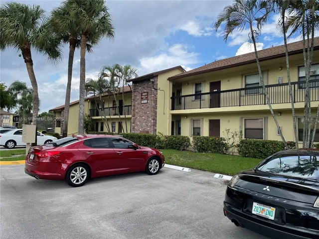 a swimming pool with outdoor seating and yard