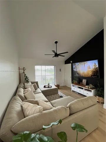 a view of wall with a large window