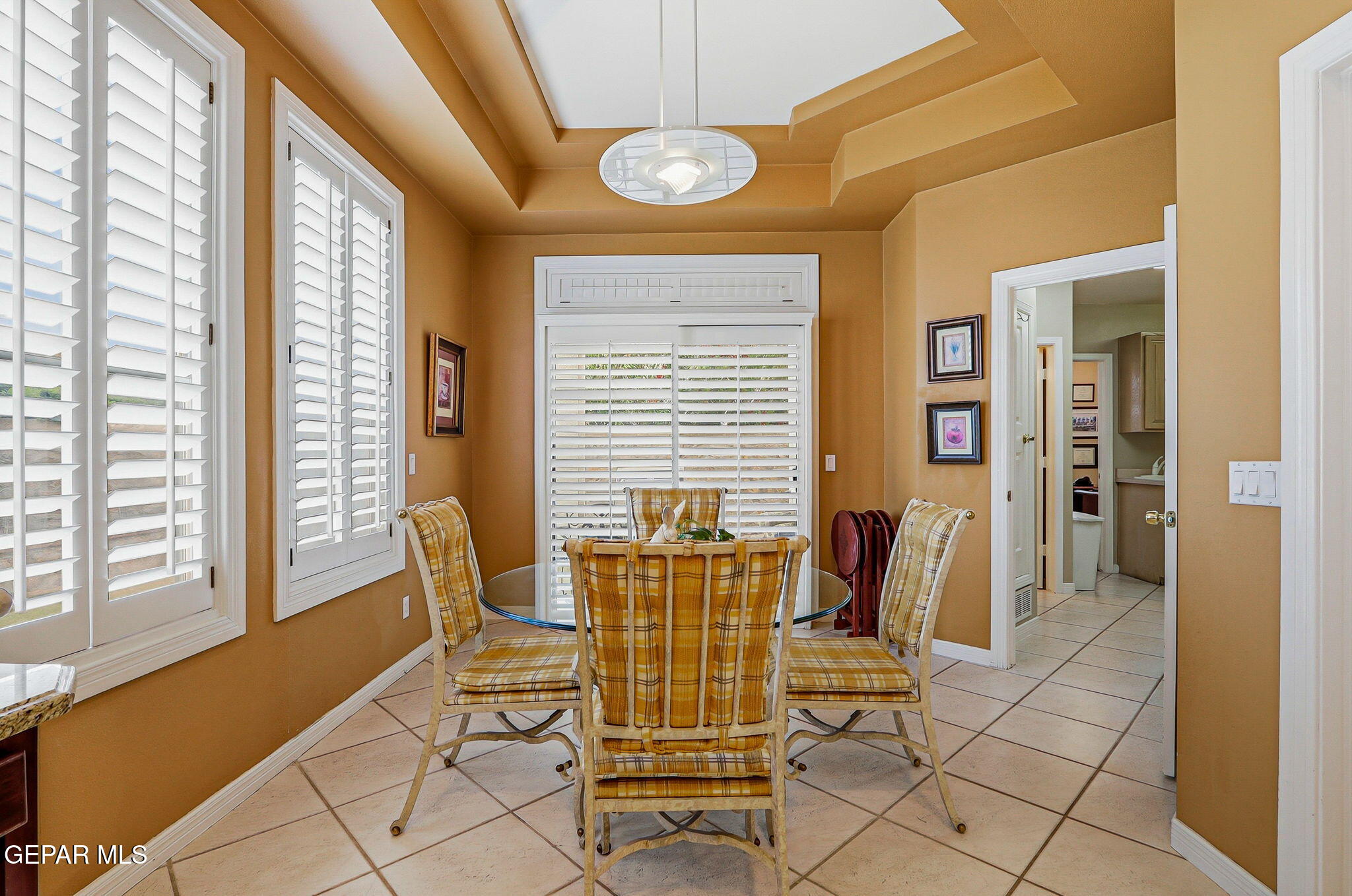 5806 Diamond Point Circle El Paso, TX 79912 - Photo 18 of 61 a view of a dining room with furniture and windows
