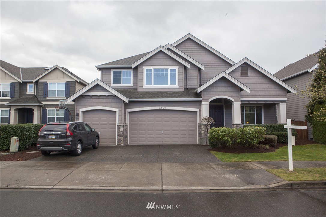 3808 186th Street Southeast Bothell, WA 98012 - Photo 1 of 25 a car parked in front of a house