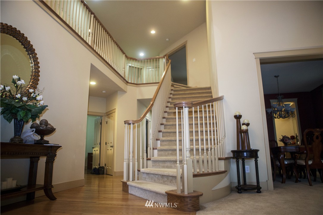 3808 186th Street Southeast Bothell, WA 98012 - Photo 2 of 25 a view of entryway with wooden floor and stairs