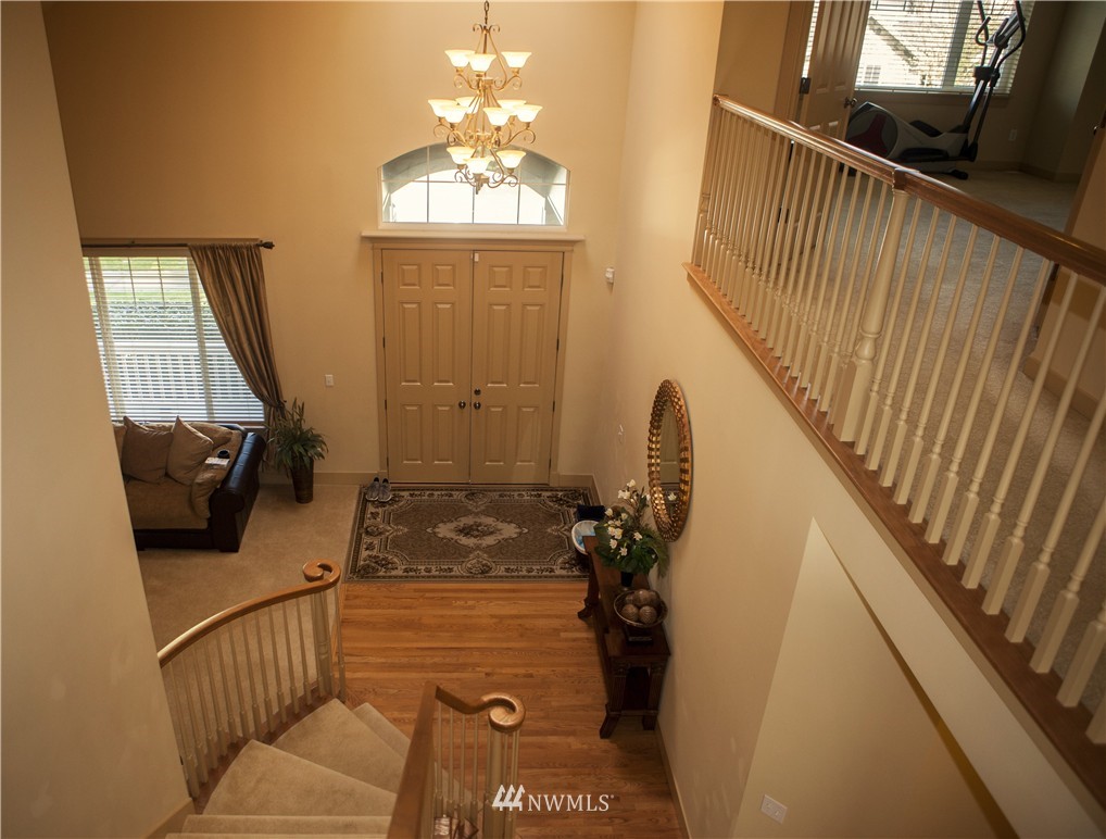 3808 186th Street Southeast Bothell, WA 98012 - Photo 14 of 25 a living room with furniture and a chandelier