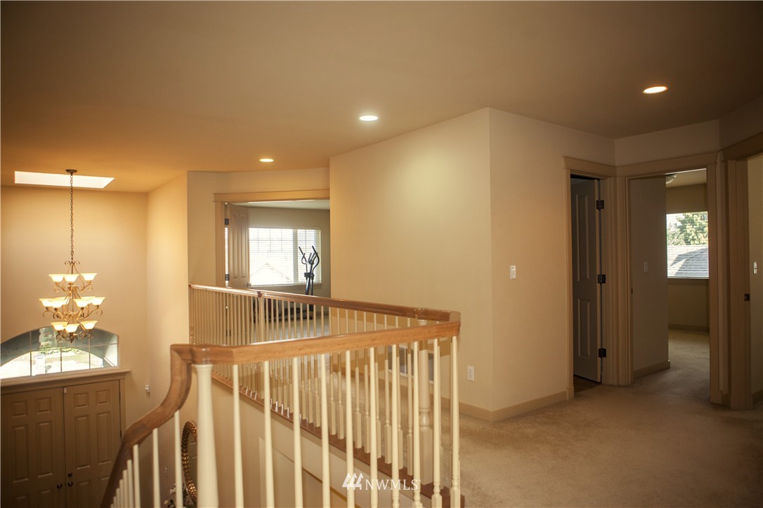 3808 186th Street Southeast Bothell, WA 98012 - Photo 15 of 25 a view of a hallway to a livingroom with furniture