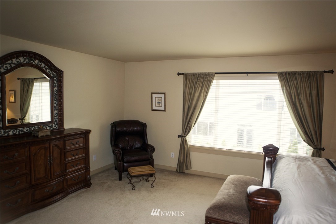 3808 186th Street Southeast Bothell, WA 98012 - Photo 17 of 25 a room with furniture and a window
