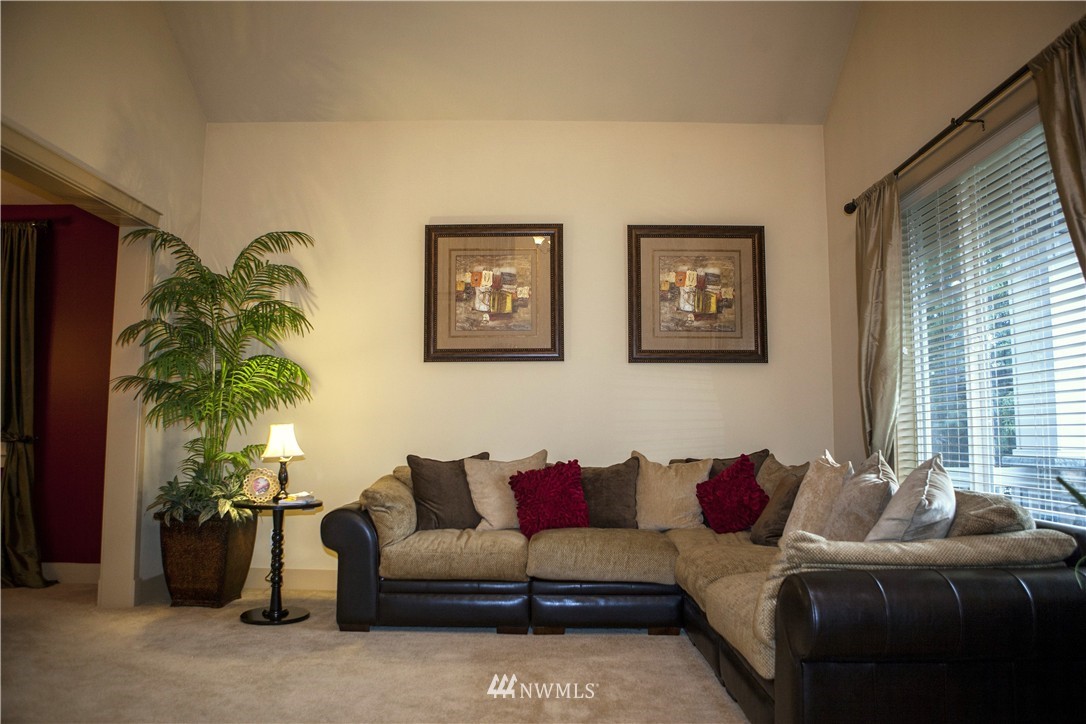 3808 186th Street Southeast Bothell, WA 98012 - Photo 3 of 25 a living room with furniture and a large window