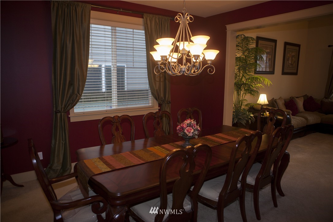 3808 186th Street Southeast Bothell, WA 98012 - Photo 4 of 25 a view of a dining room with furniture and chandelier