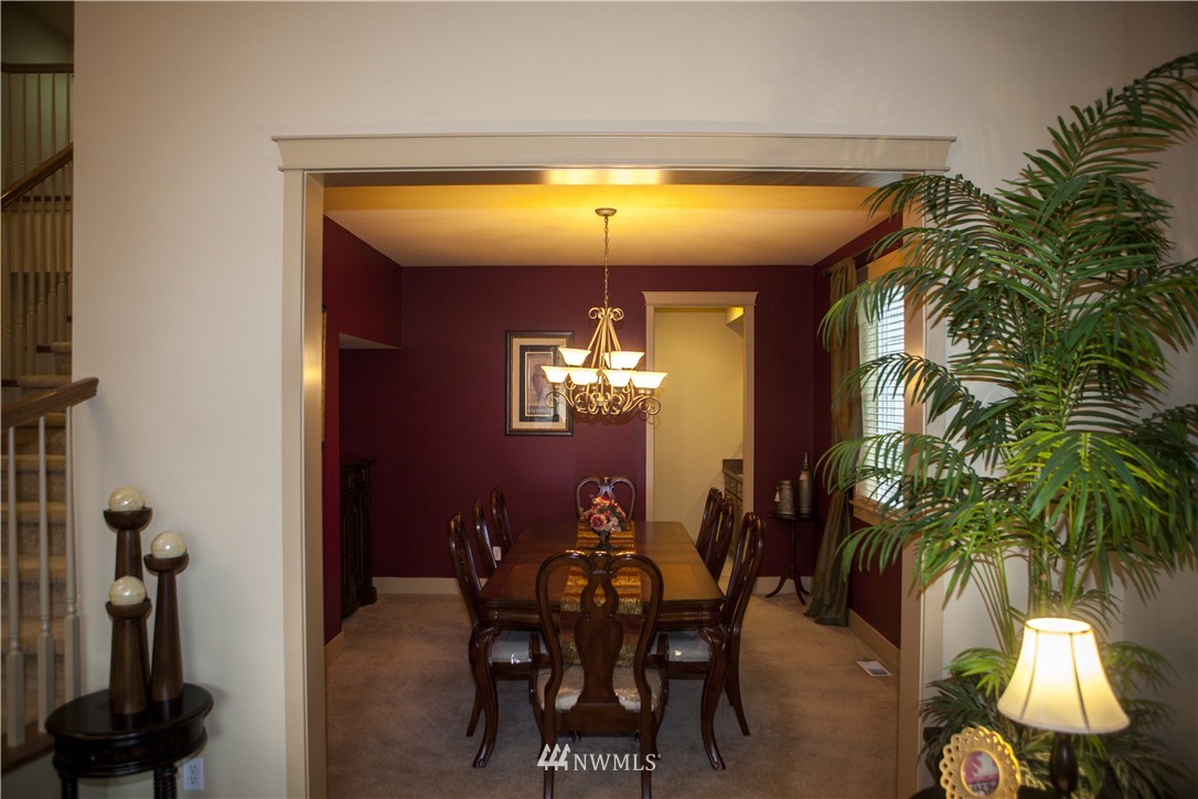 3808 186th Street Southeast Bothell, WA 98012 - Photo 5 of 25 a view of a dining room with furniture and chandelier