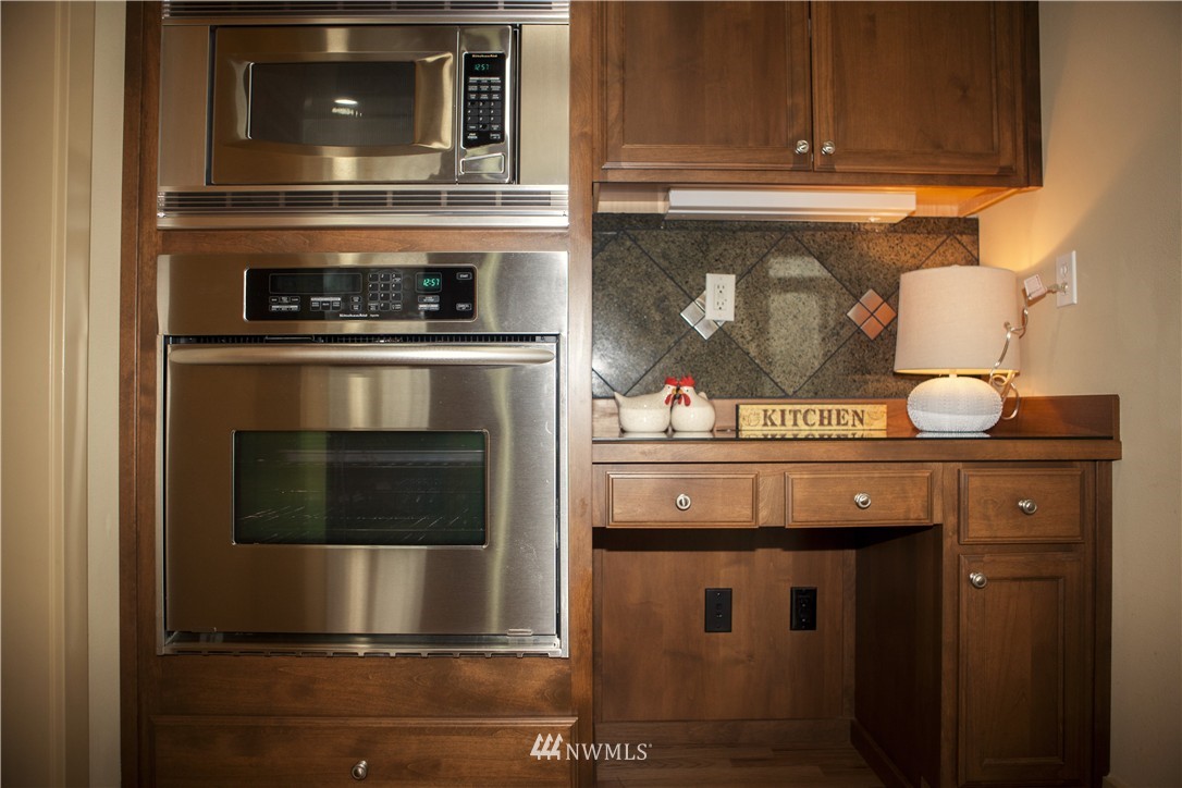 3808 186th Street Southeast Bothell, WA 98012 - Photo 8 of 25 a kitchen with a stove and cabinets