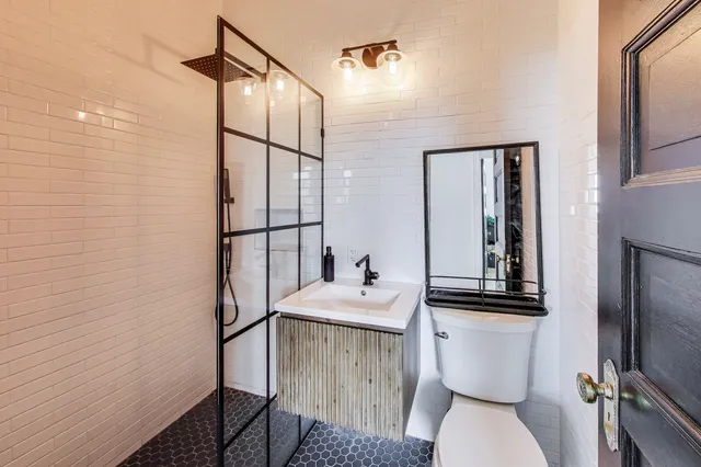 a bedroom with a bed and a desk