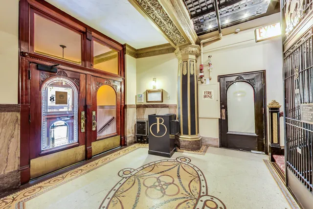 a view of a hallway with a washer and dryer
