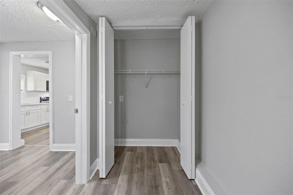 5045 Green Key Road New Port Richey, FL 34652 - Photo 19 of 32 a view of a hallway with wooden floor