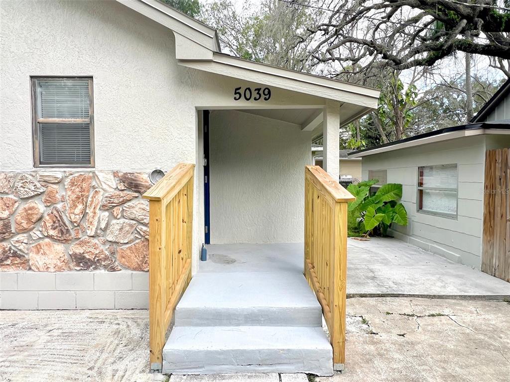 5045 Green Key Road New Port Richey, FL 34652 - Photo 2 of 32 a view of a house with a large tree