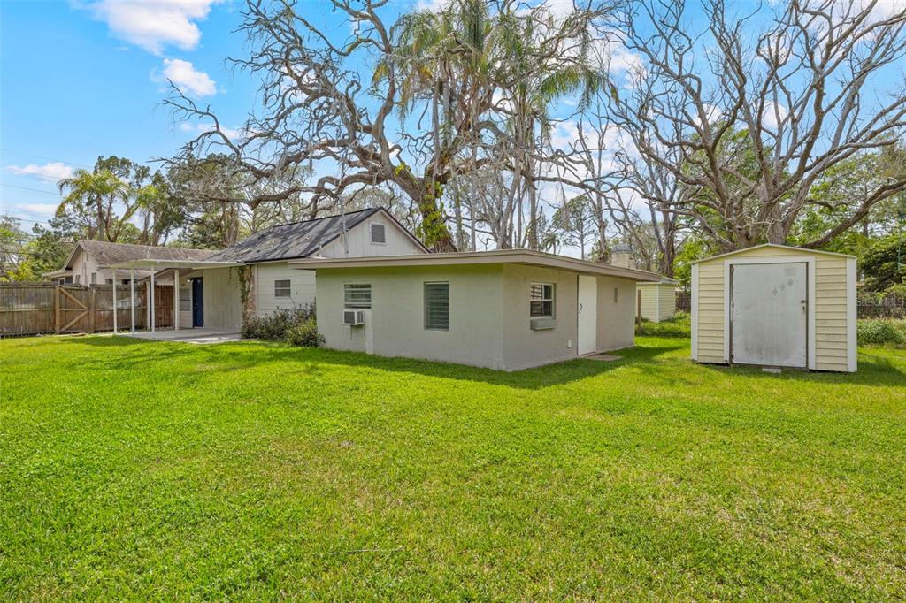 5045 Green Key Road New Port Richey, FL 34652 - Photo 26 of 32 a view of a yard with a house and garden